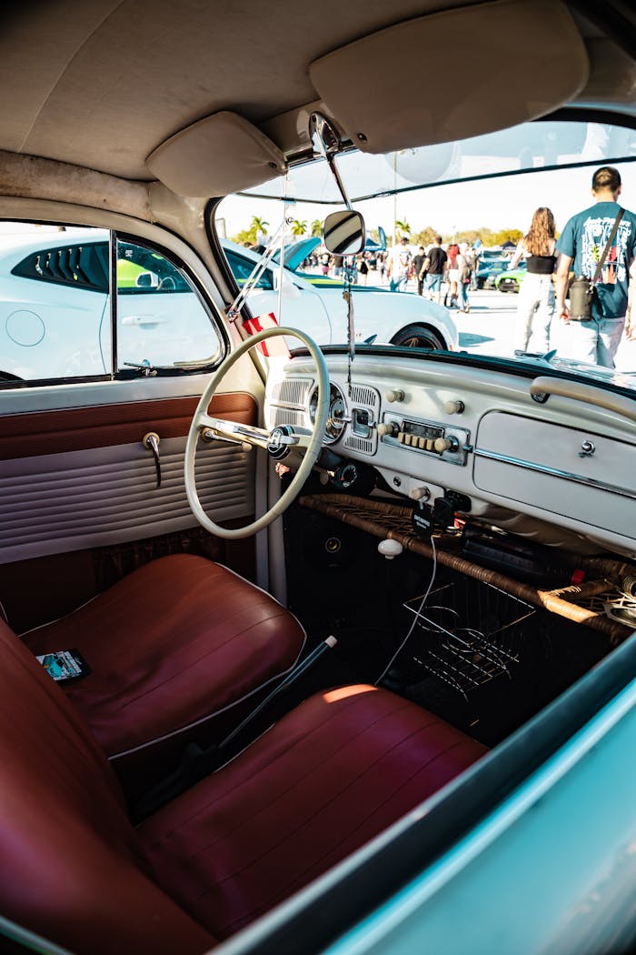 Explore the classic interior of a vintage car at an auto show in West Palm Beach, Florida.