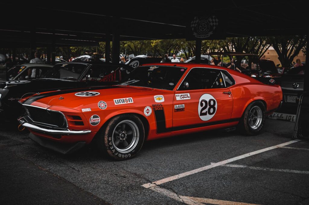pexels photo 29067154 A classic red Ford Mustang racecar on display outdoors in Tulsa, Oklahoma.